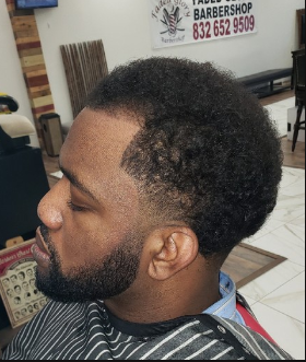 Textured curly fade with sharp edge up
